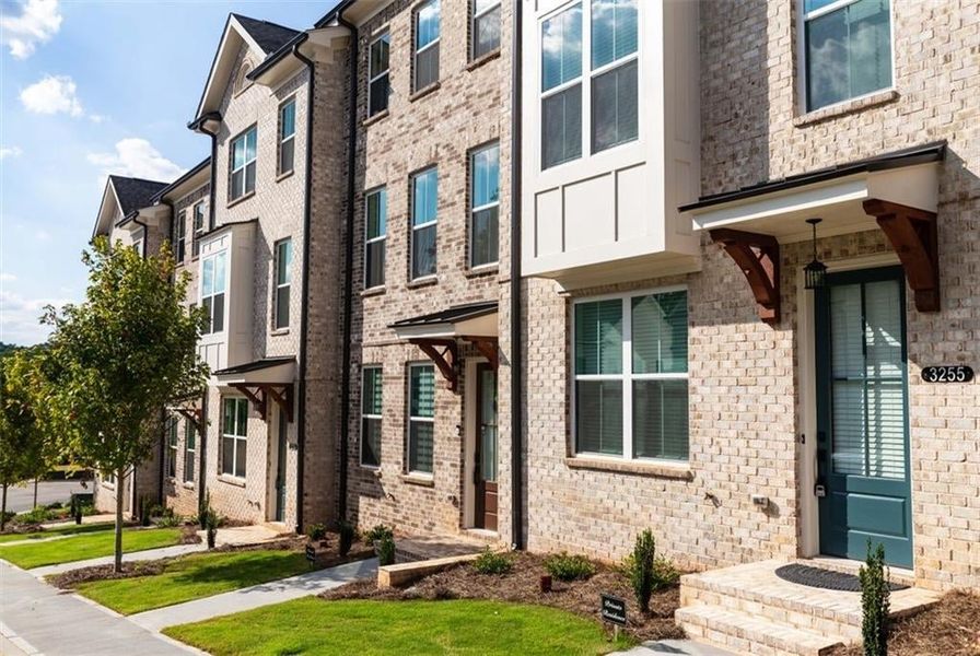 Sidewalk right up to your front door.   Picture NOT of actual home, but a representation of a previously built TPG property.