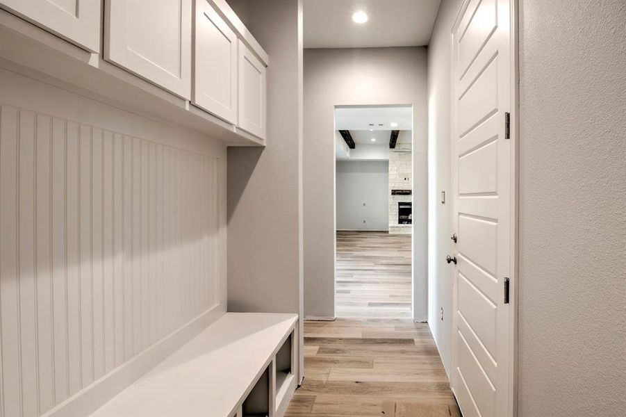 Mudroom featuring light wood-type flooring