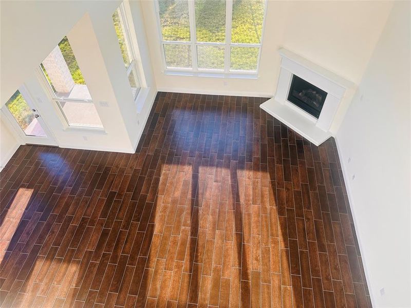 Unfurnished living room featuring dark hardwood / wood-style flooring