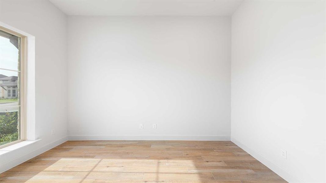 Empty room with light wood-type flooring