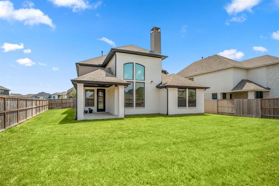 Head outside to see all the greenspace this home offers! The back of the home includes lots of windows letting in natural light and a perfect view of the private backyard.