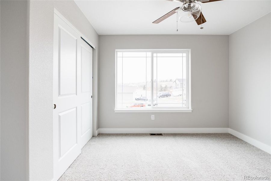 bedroom three with privacy at the end of the hallway