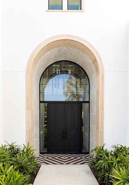 The elegant entrance has a grey Leuter's Limestone arch surround, the same stone is used for stone window sills and crown moldings.