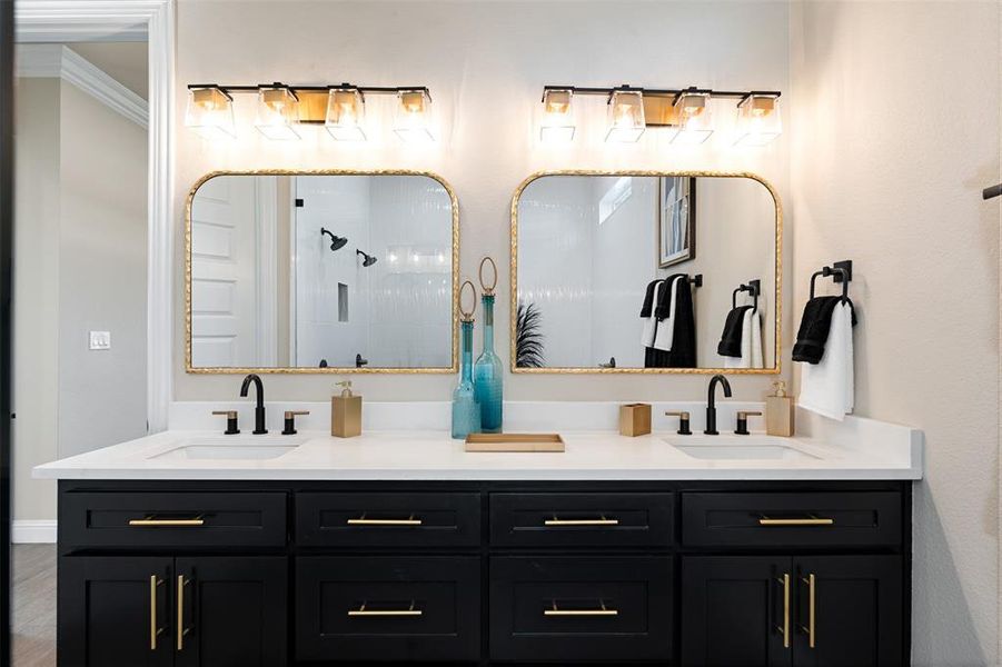 Bathroom featuring hardwood / wood-style floors, walk in shower, vanity, and crown molding