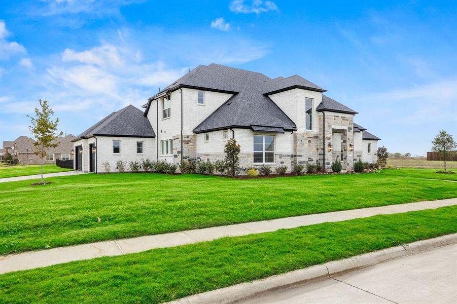 View of front of property featuring a front lawn