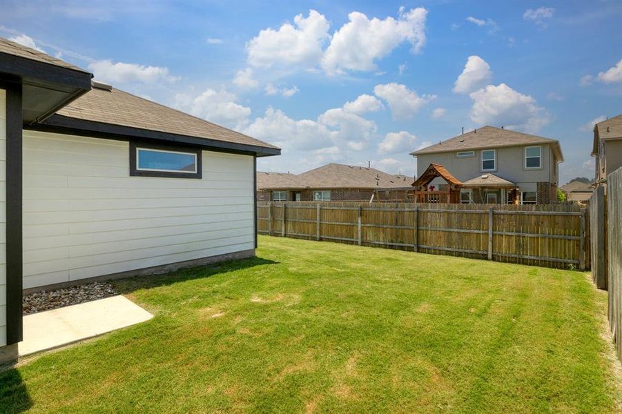 Enjoy outdoor activities in the fenced backyard, offering privacy and security.