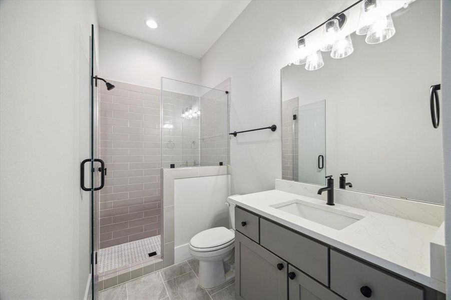 Guest suite bath with frameless shower.