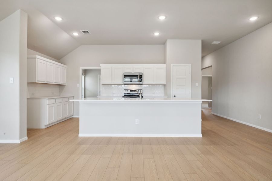 Kitchen in the Diamond home plan by Trophy Signature Homes – REPRESENTATIVE PHOTO