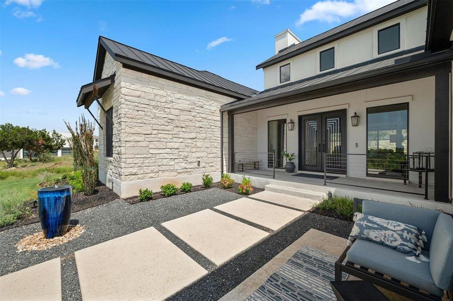 Limestone Walkway and covered front porch to take in the view.