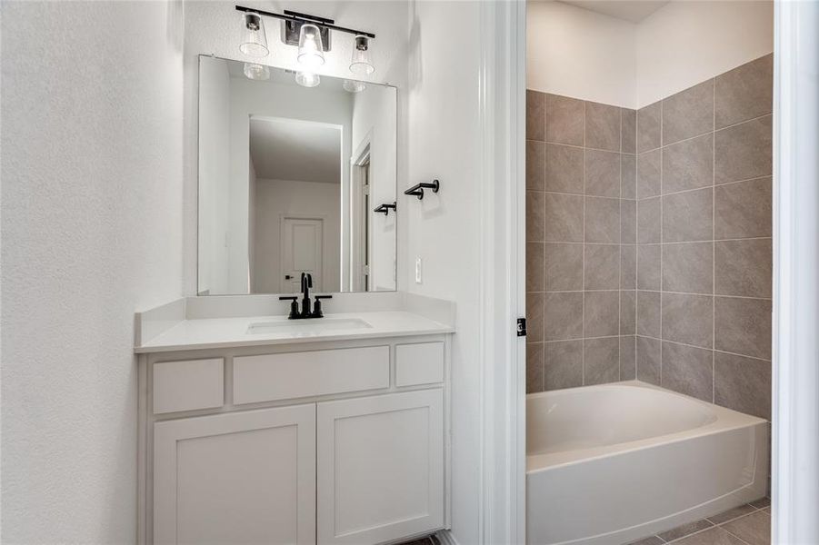 Bathroom featuring vanity and tile patterned floors