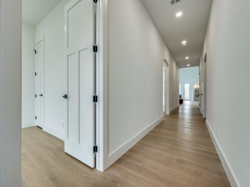 Corridor featuring light wood-type flooring