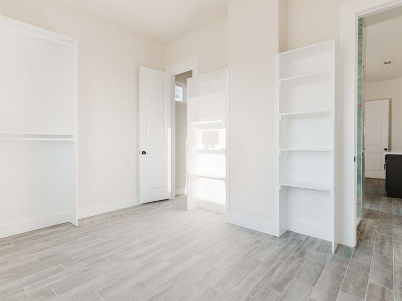 Unfurnished bedroom featuring light hardwood / wood-style flooring