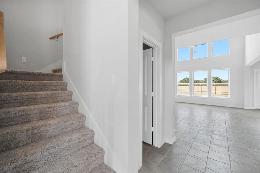 Stairs and door to powder bath