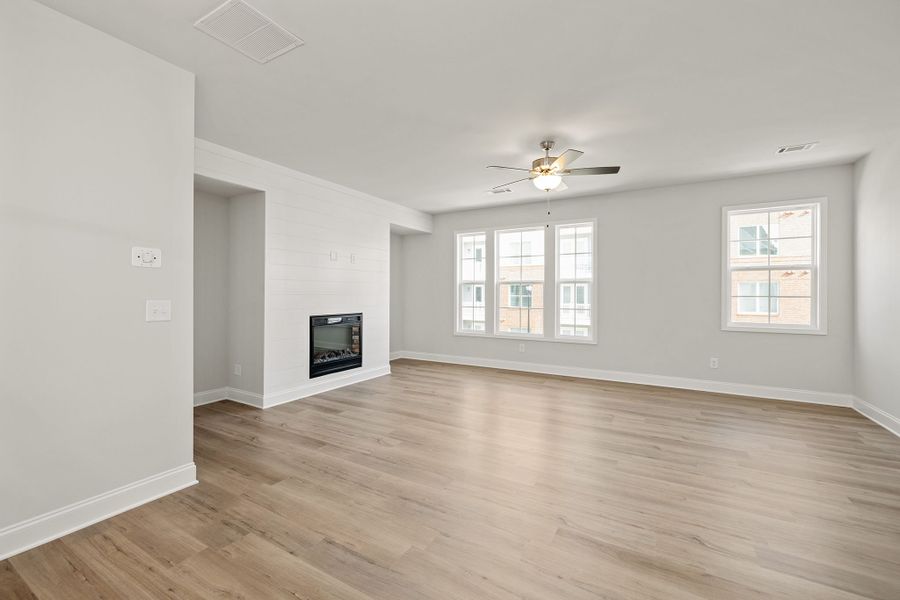 Expansive family room includes a wall of windows