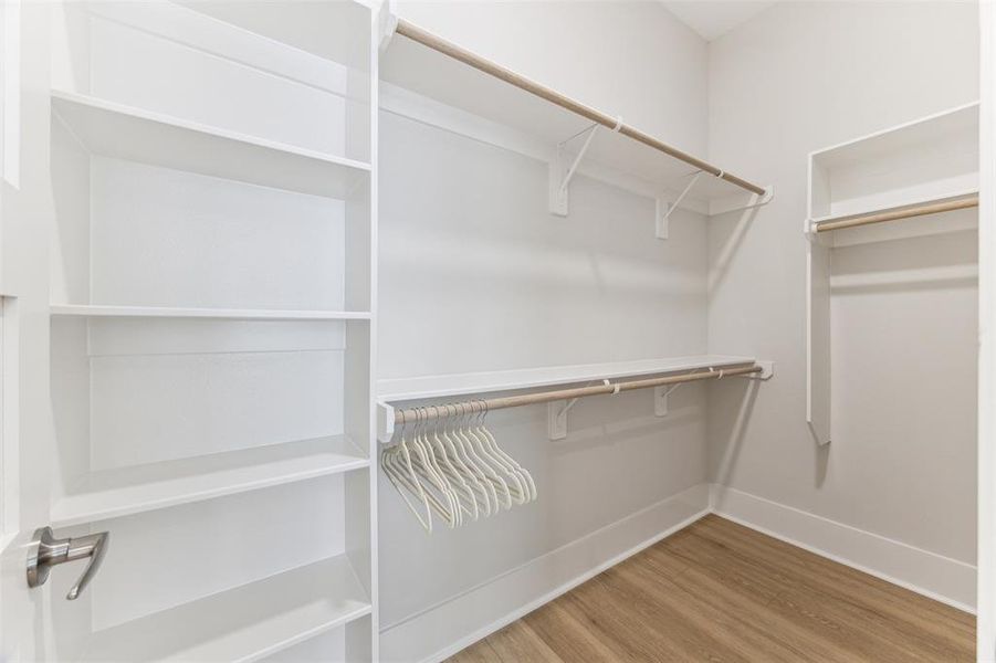 One of the two spacious walk in closets in the Primary suite.