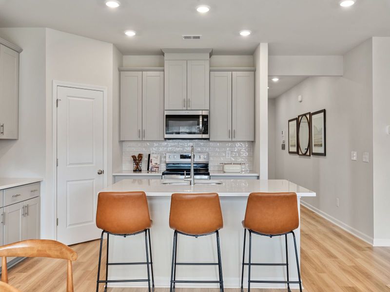 The gourmet kitchen is fitted with walk-in pantry and designer finishes.