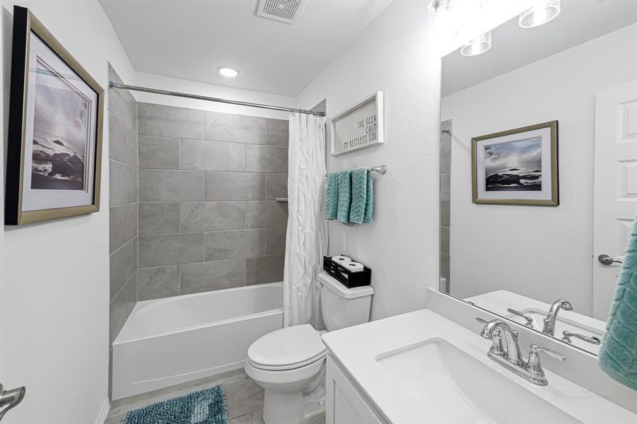 Yet another bathroom upstairs is perfect for family and guests!