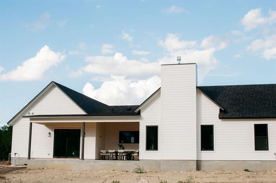 The back of the home features a large covered porch and is already set with a gas BBQ stub out for grilling.