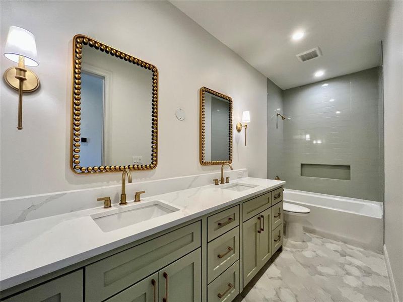 Full bathroom with shower / bathing tub combination, vanity, toilet, and tile patterned flooring