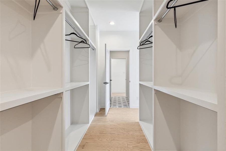 Section of Primary Bedroom Closet. Representative photo from a similar home completed by the builder, Homebound.
