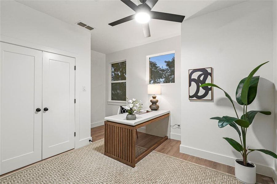 Bathroom featuring walk in shower, vanity, and tile patterned floors