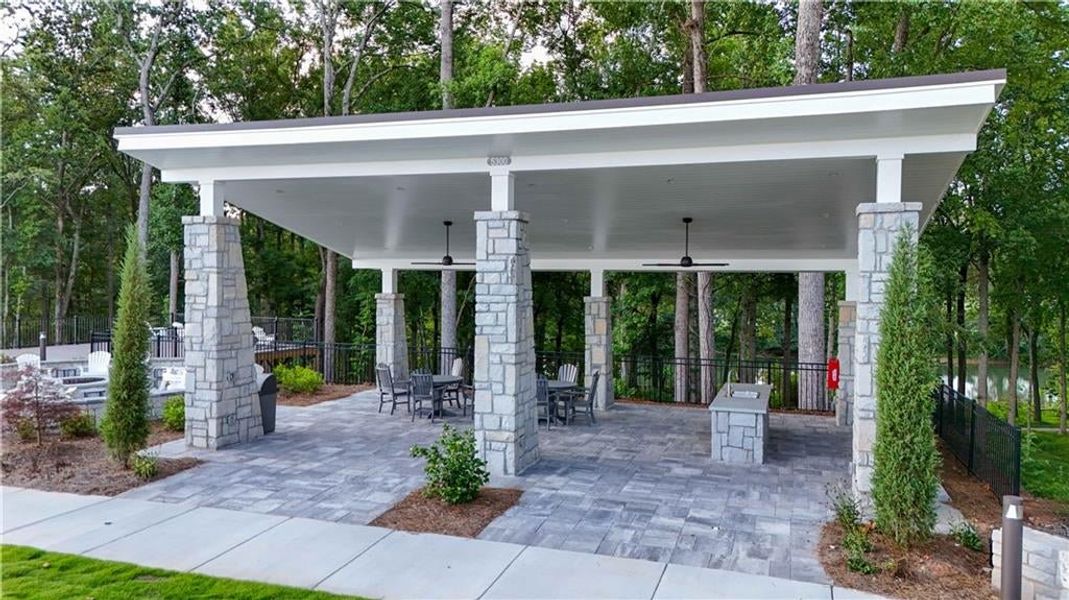 Covered deck with seating overlooking the serene river!