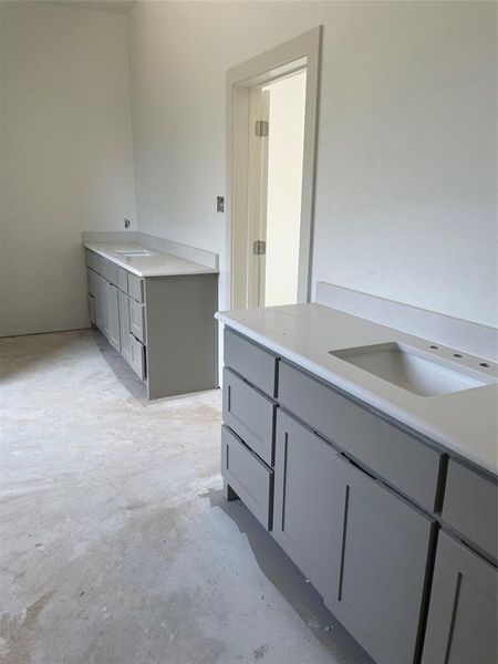 Bathroom featuring concrete floors and vanity