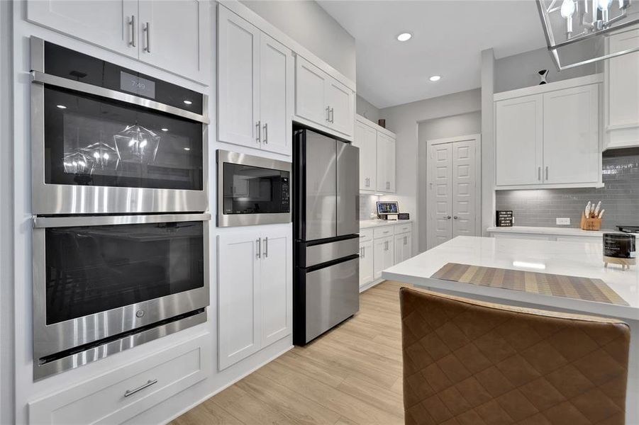 Sleek Stainless Steel Appliances Including Double Ovens