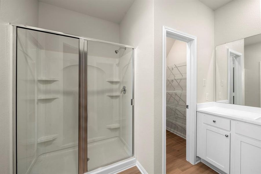 The primary bathroom features large walk in shower, and two spacious walk-in closets.