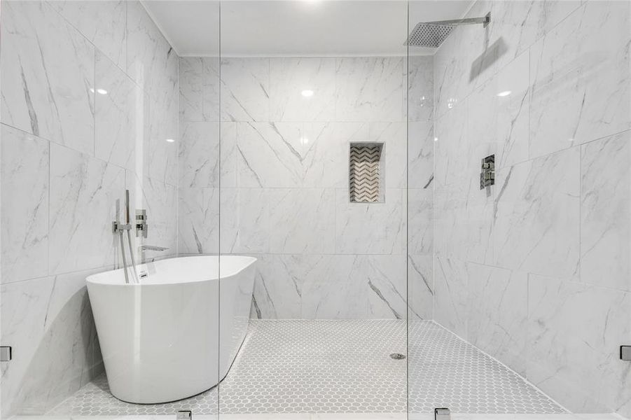 Bathroom with tile walls and tiled shower