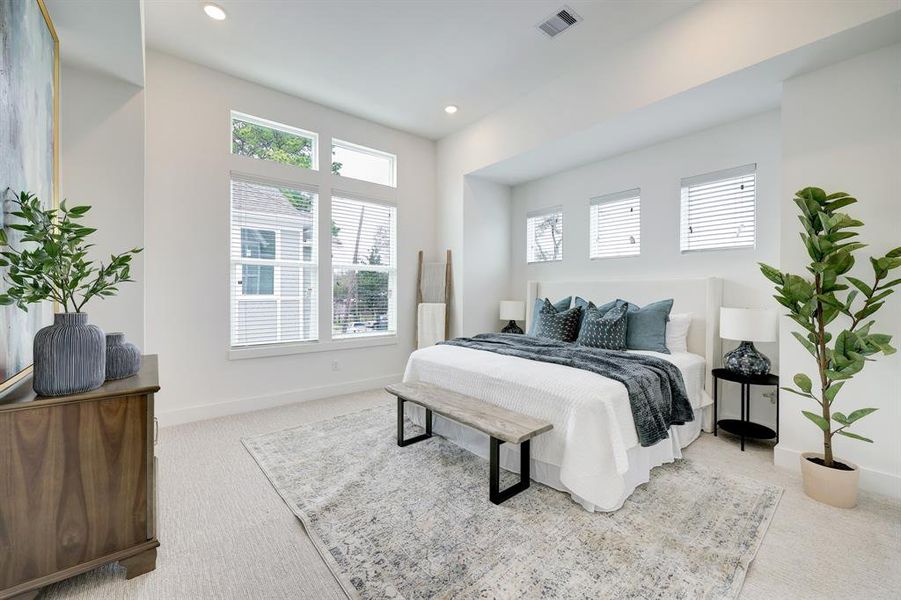 Serene Master Suite: Bathed in natural light with ample space for relaxation.