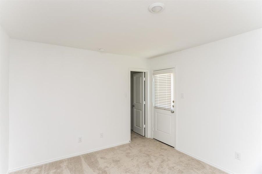 View of carpeted primary bedroom