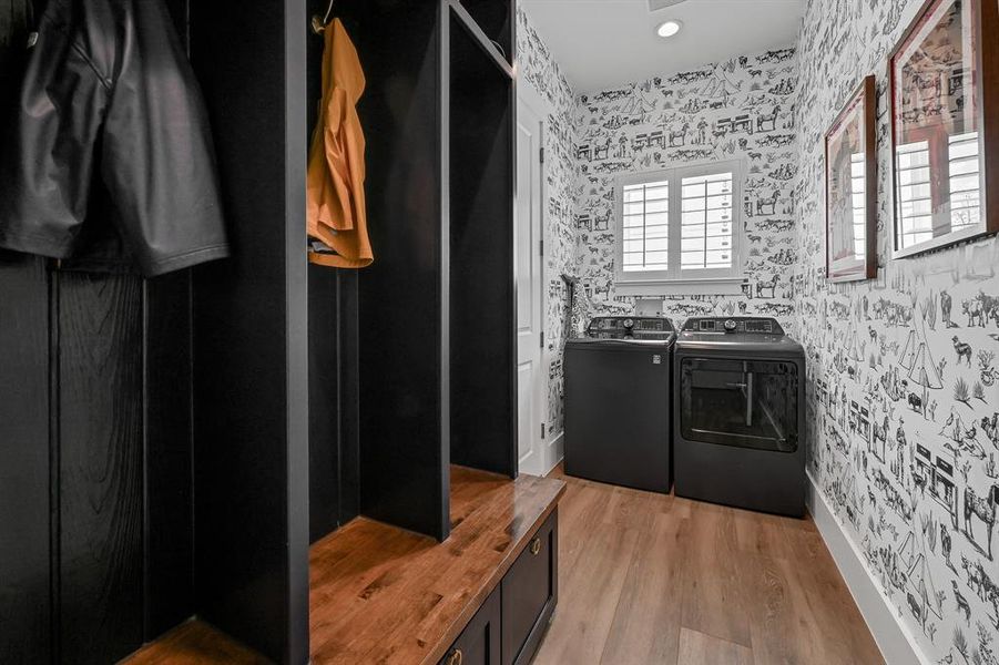 Utility room with custom built coat rack and storage beneath.