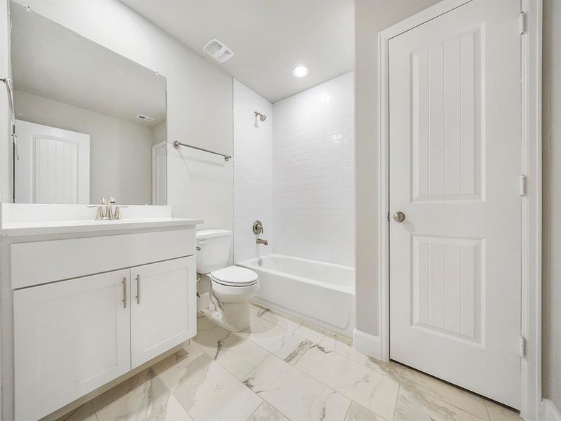 The Secondary Bathroom is located near the two secondary bedrooms! (Sample photo of a completed Sterling Floor Plan. Image may show alternative features/and or upgrades.)