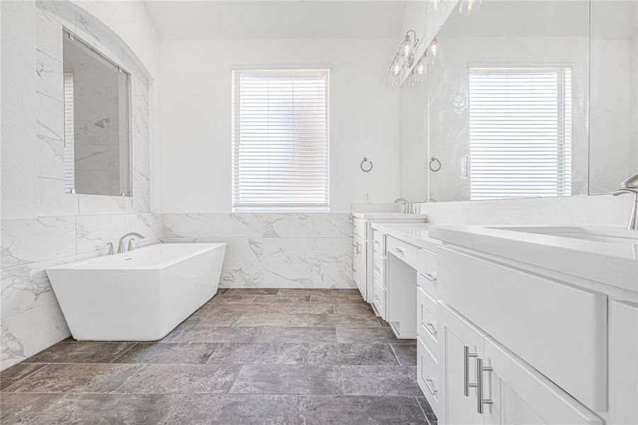 The centerpiece of this bathroom is a luxurious soaking tub, perfect for unwinding after a long day,