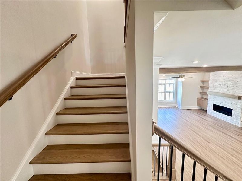 Enjoy wide, split staircase leading to the upper level owner suite +2 additional guest bedrooms