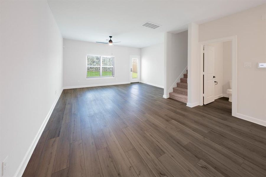 The living room is bright, full of natural light and has beautiful, luxury plank flooring that your guests will love.