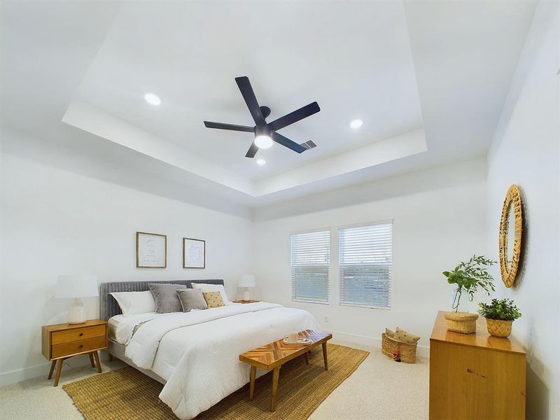 Gorgeous  primary bedroom on second floor with lots of natural lighting.
