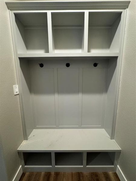 Mudroom with dark wood-type flooring