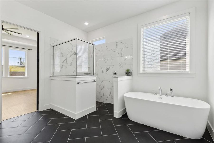 Bathroom featuring independent shower and bath and tile patterned floors