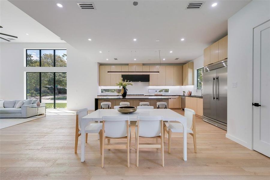 Dining space with light wood-type flooring