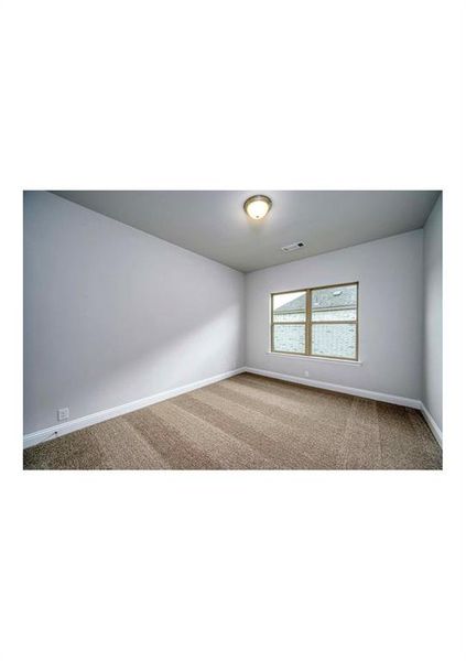 Unfurnished room with carpet flooring