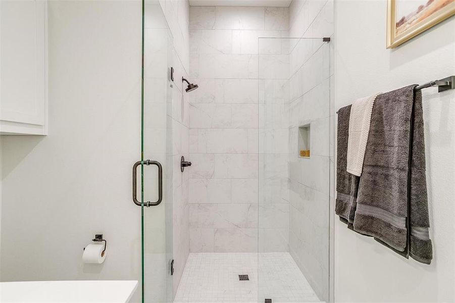 The highlight? A spacious walk-in shower, adding a touch of spa-like indulgence to your daily routine.