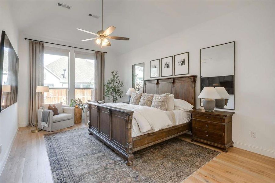 Bedroom with ceiling fan and light hardwood / wood-style flooring