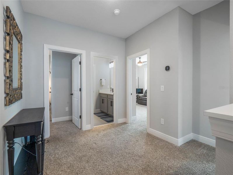 large hallway in between the secondary bedrooms