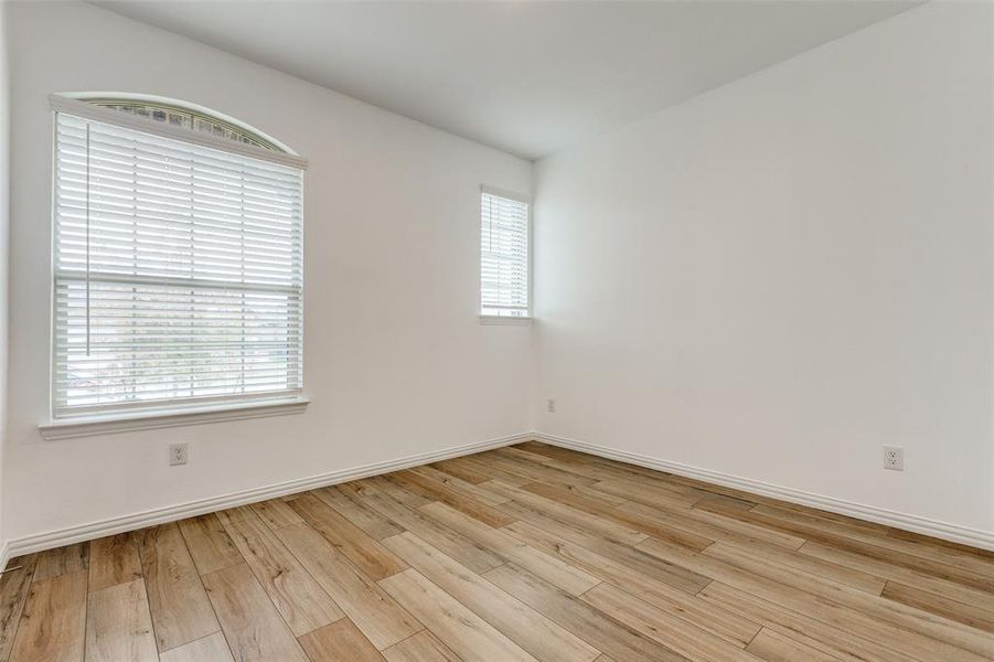 Unfurnished room with light hardwood / wood-style flooring