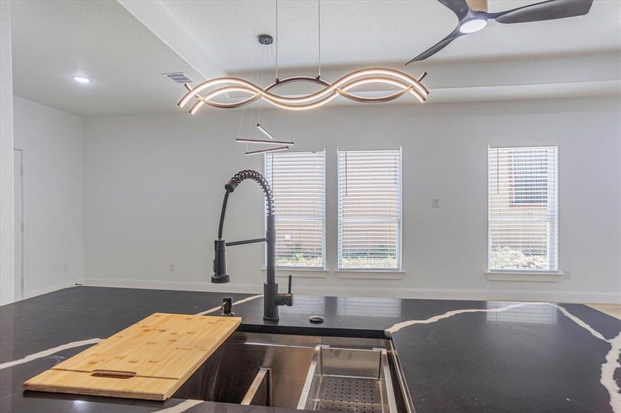 Kitchen featuring ceiling fan