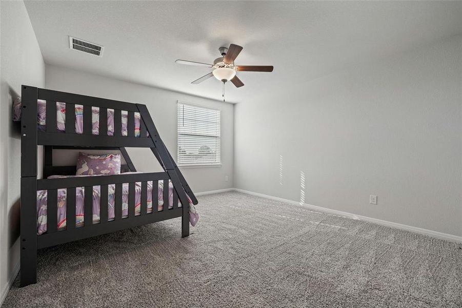 Large Secondary Bedroom Upstairs with Ceiling Fan.