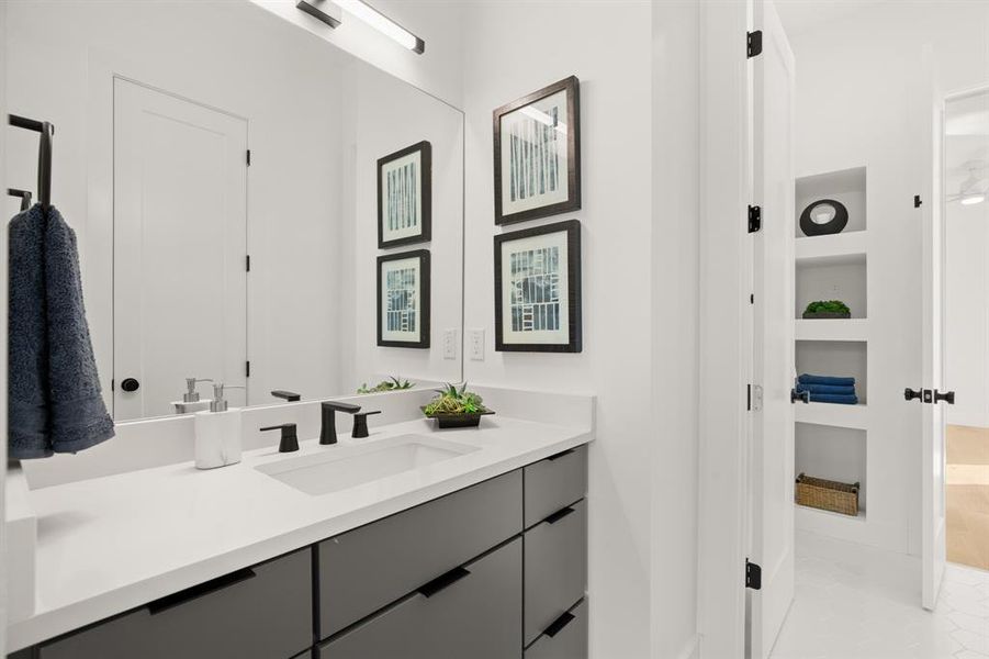 Each secondary bedroom offers their own private vanity areas with custom contemporary vanities, stylish designer finishes, and a walk-in closet. The other vanity area mirrors this one.