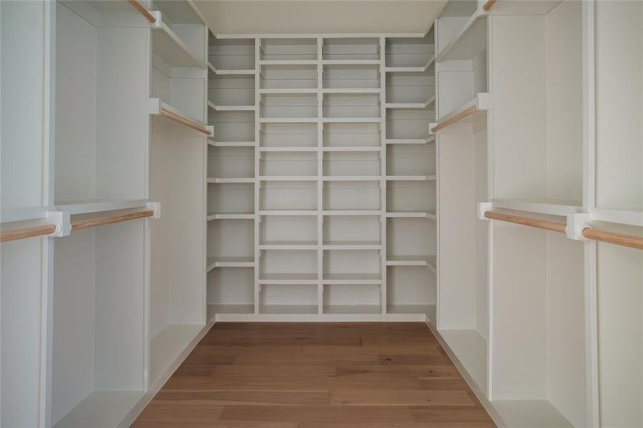 Walk in closet featuring hardwood / wood-style floors